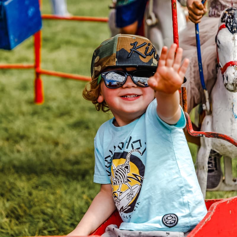 Happy kid enjoying the fun day at kids Racing day