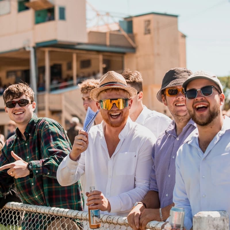 Group of young male friends enjoying the event